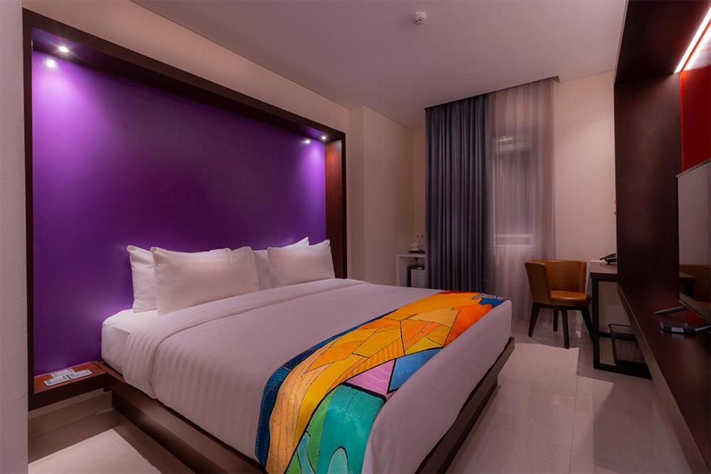 Tempat tidur dalam kamar di Grand Picasso Hotel