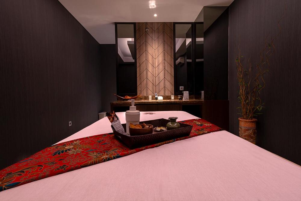 Postel nebo postele na pokoji v ubytování Grand Picasso Hotel