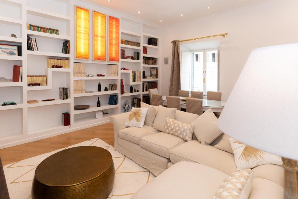 a living room with a couch and a table at Luxury Laura Vatican Apartment ROMA CENTRO in Rome