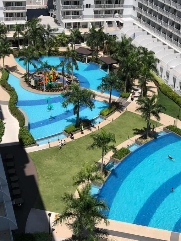 an aerial view of the pool at the resort at Best Value Q Condo1439 in Manila