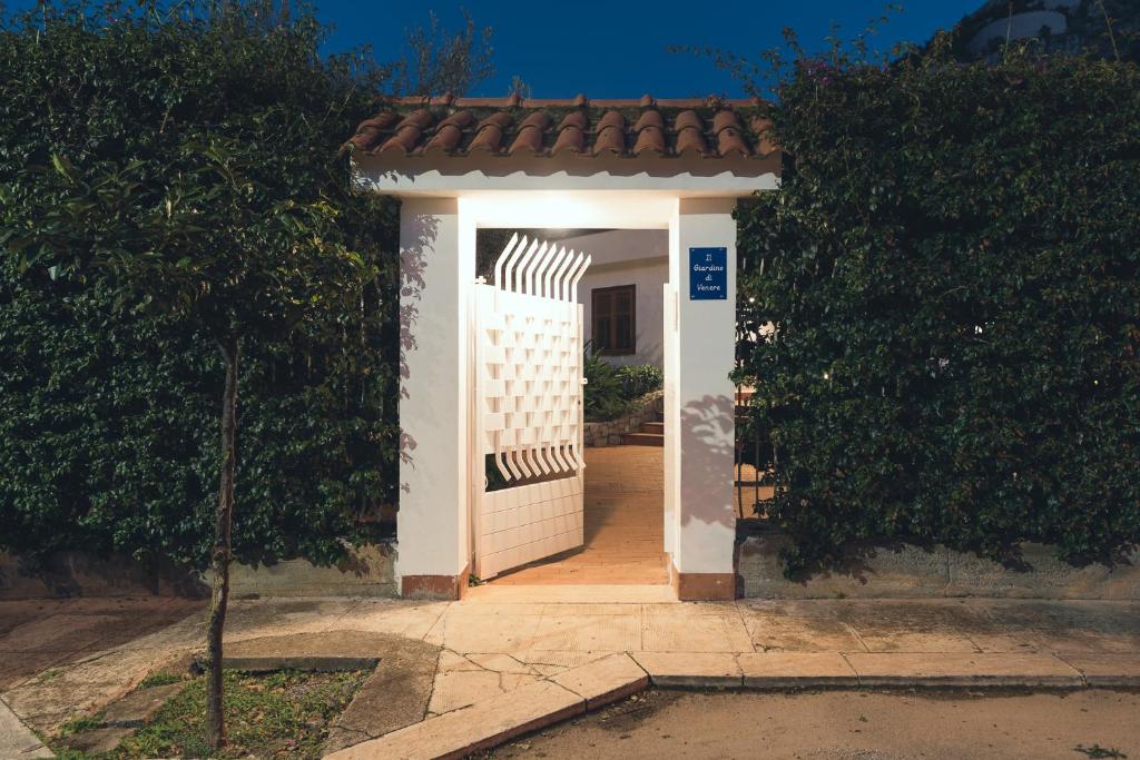 a gate to a house with a white fence at Il Giardino di Venere in Mondello