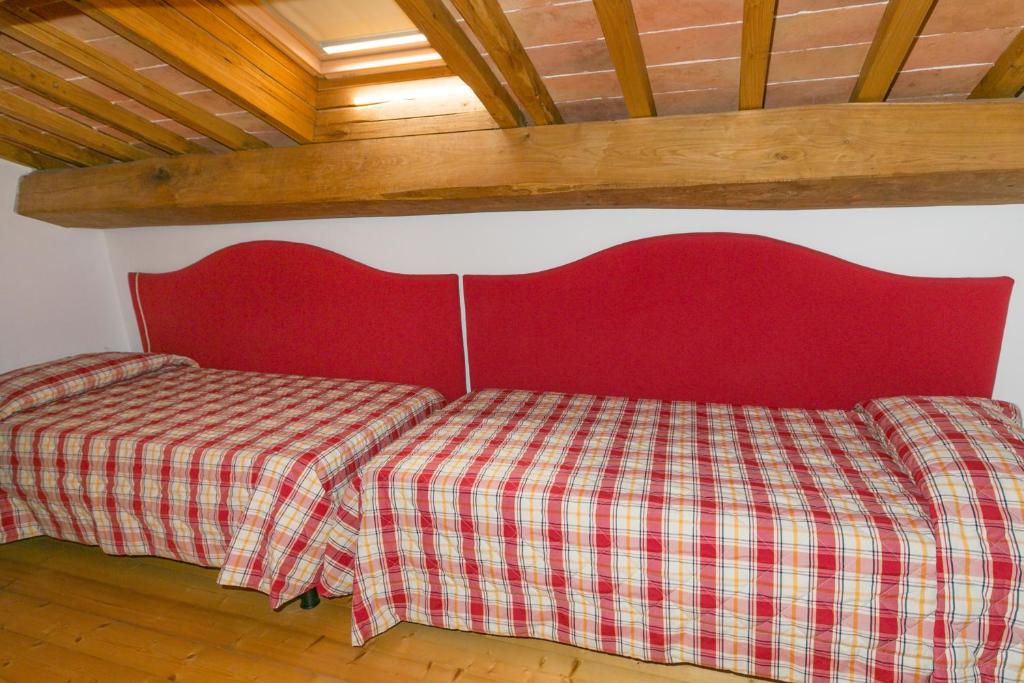 Postel nebo postele na pokoji v ubytování Relais La Pieve Vecchia