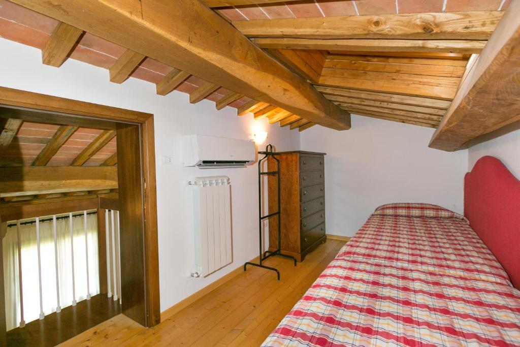 Postel nebo postele na pokoji v ubytování Relais La Pieve Vecchia
