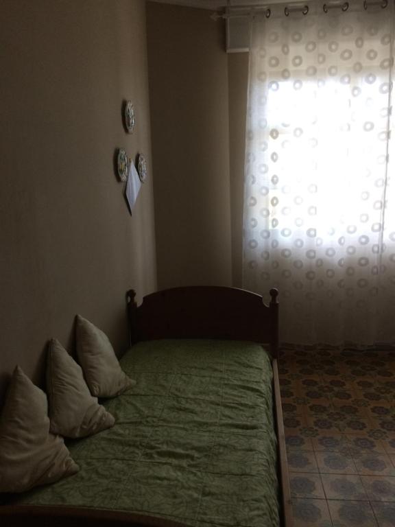 Postel nebo postele na pokoji v ubytování Villa L'Ottagono con cucina parcheggio privato telecamerizzato e wifi