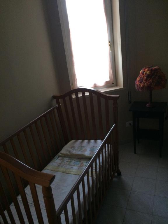 Postel nebo postele na pokoji v ubytování Villa L'Ottagono con cucina parcheggio privato telecamerizzato e wifi