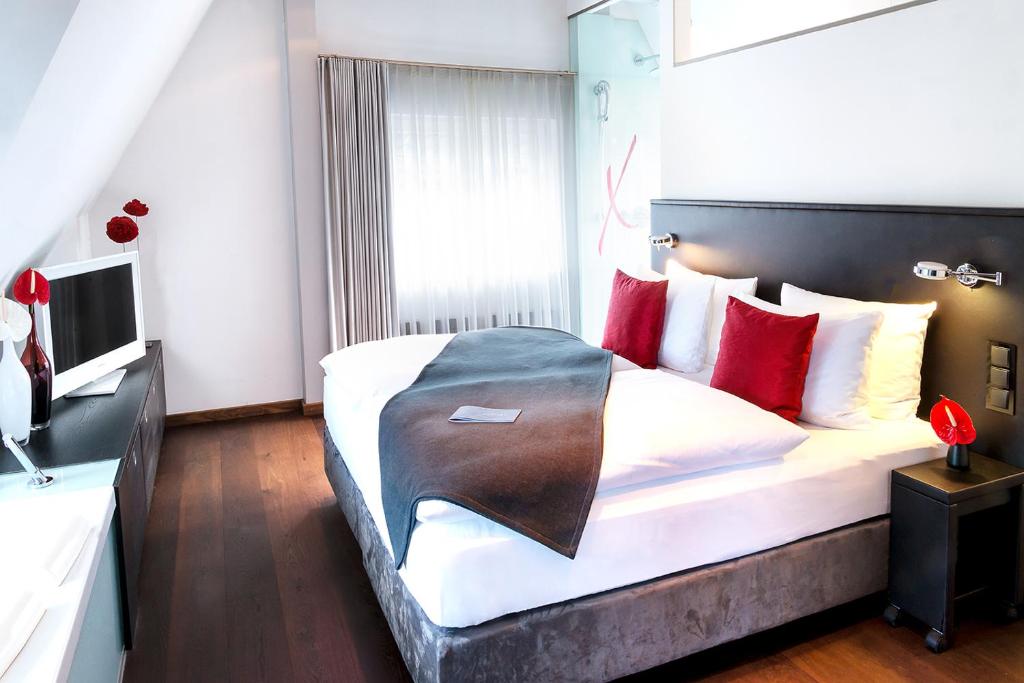 Postel nebo postele na pokoji v ubytování niXe Boutiquehotel & Spa