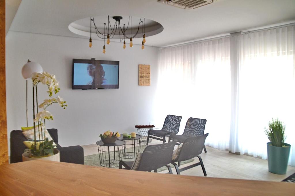 TV a/nebo společenská místnost v ubytování Ouril Hotel Julia