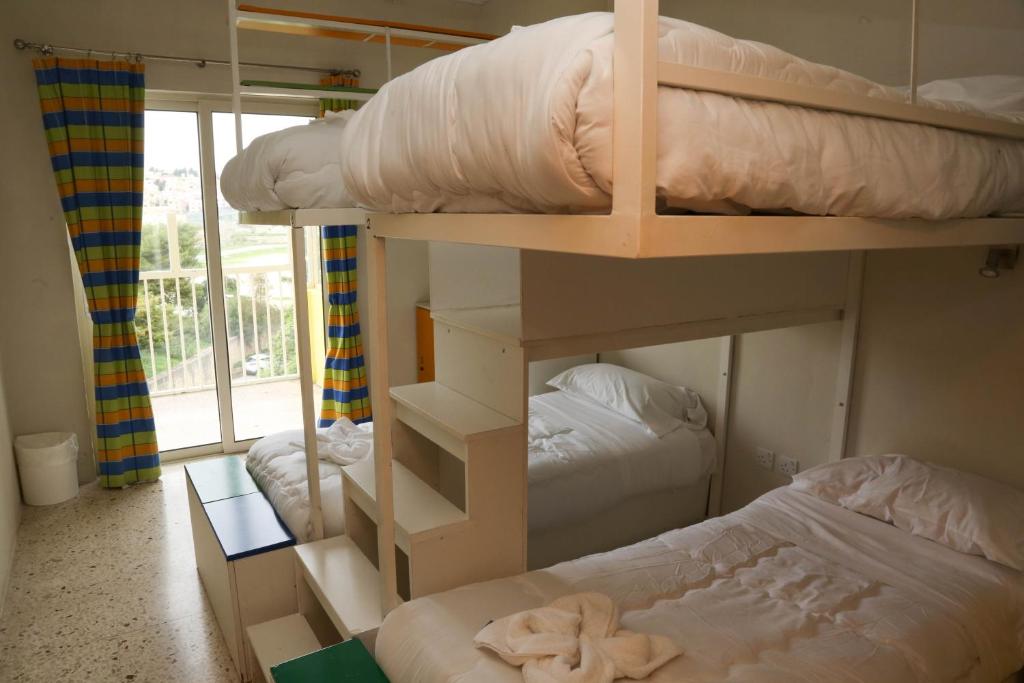 Postel nebo postele na pokoji v ubytování NSTS Campus Residence and Hostel