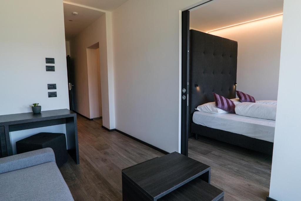 Postel nebo postele na pokoji v ubytování Hotel Raffl
