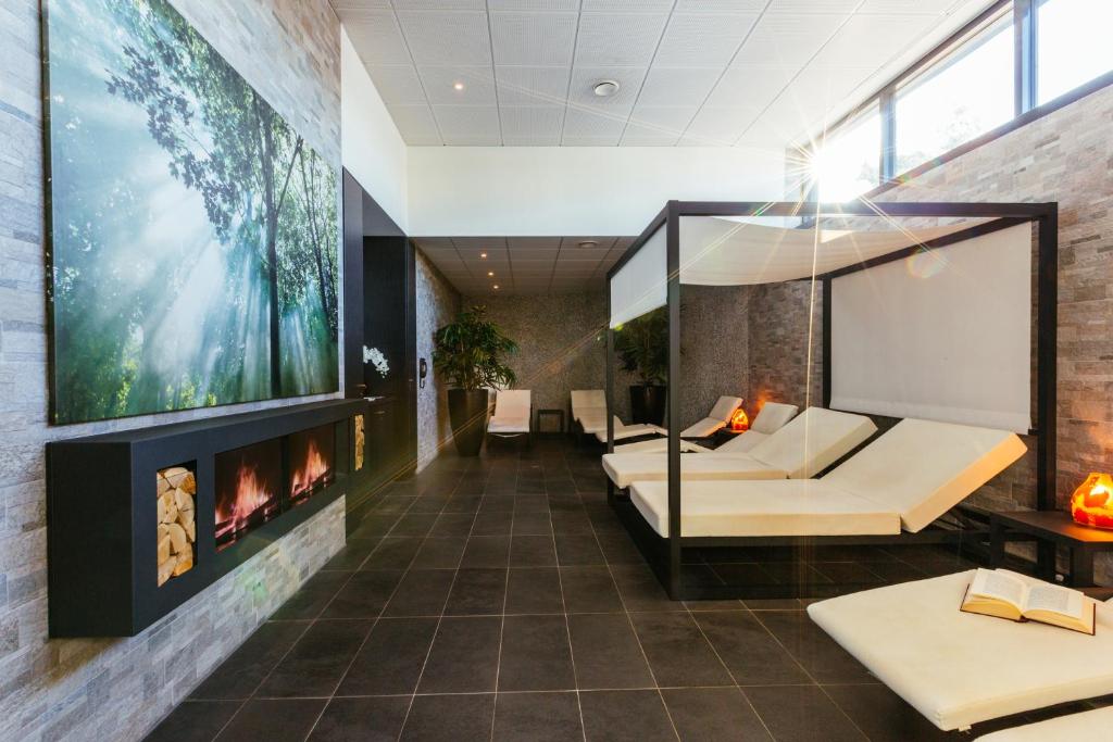 Postel nebo postele na pokoji v ubytování Hôtel Restaurant Athena Spa