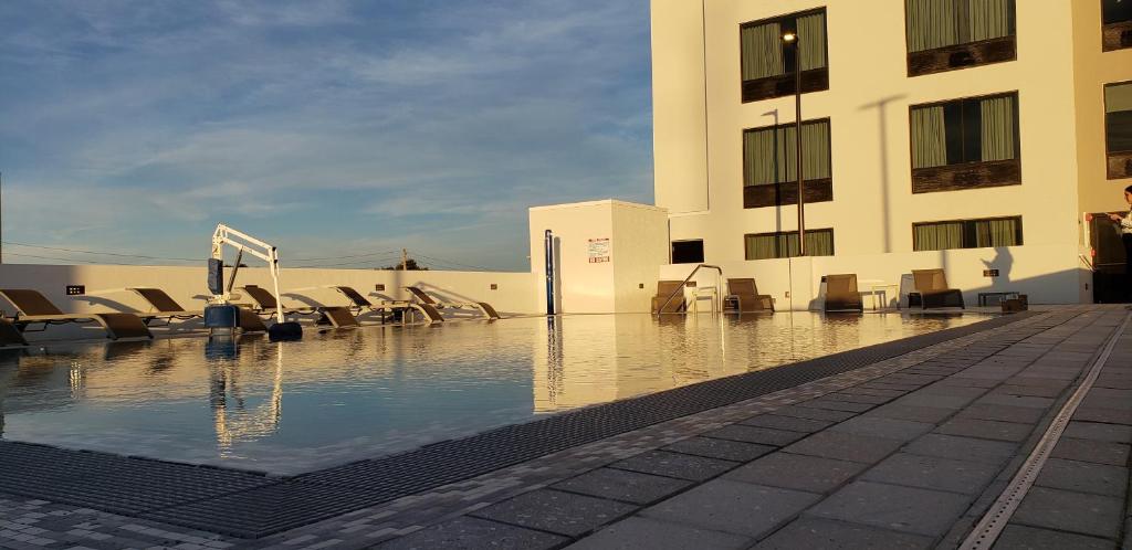 a pool of water in front of a building at Wyndham Garden Ft Lauderdale Airport & Cruise Port in Dania Beach