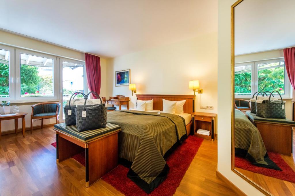 Postel nebo postele na pokoji v ubytování Moselromantik Hotel Kessler Meyer