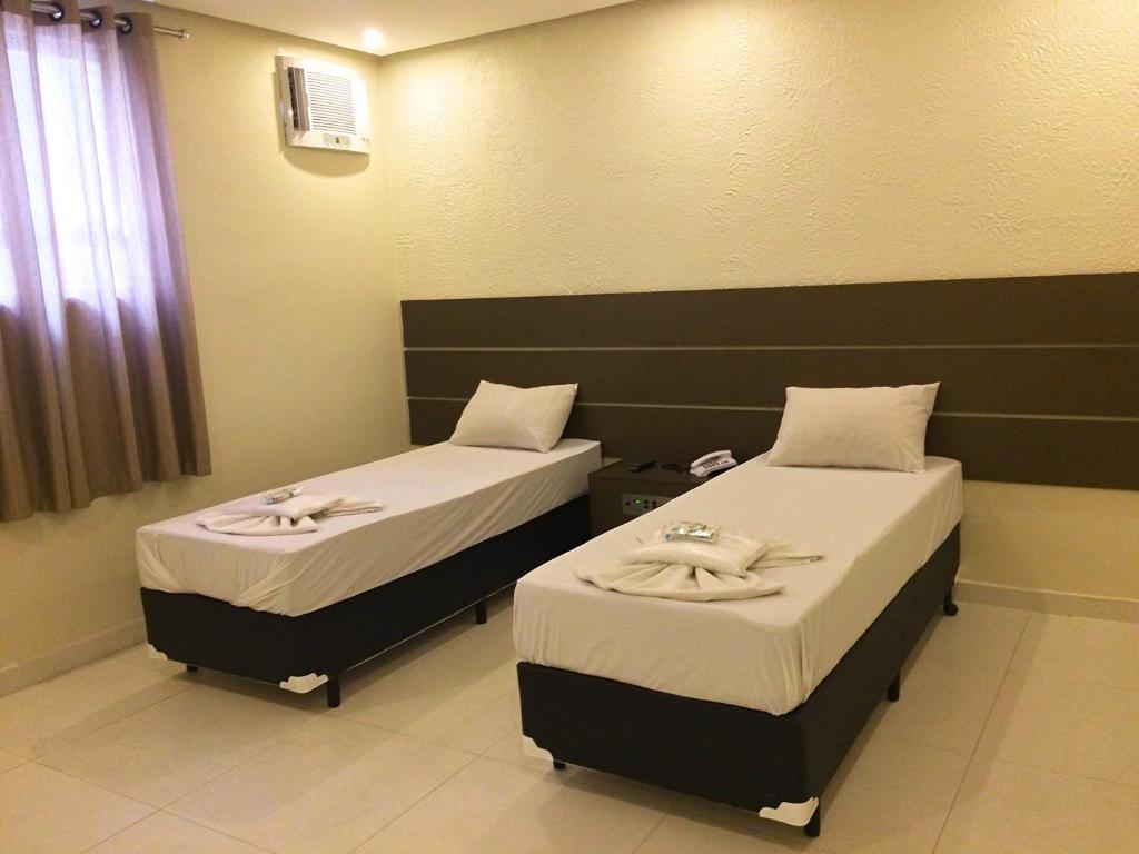 Cama o camas de una habitación en Rouge Hotel
