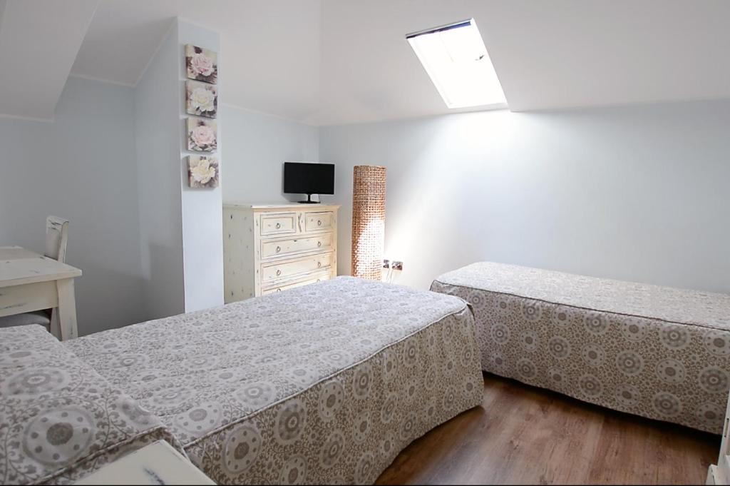 Postel nebo postele na pokoji v ubytování Hotel Risi