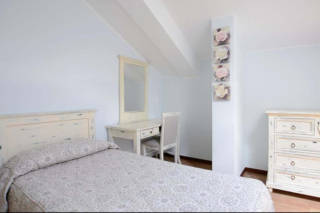 Postel nebo postele na pokoji v ubytování Hotel Risi