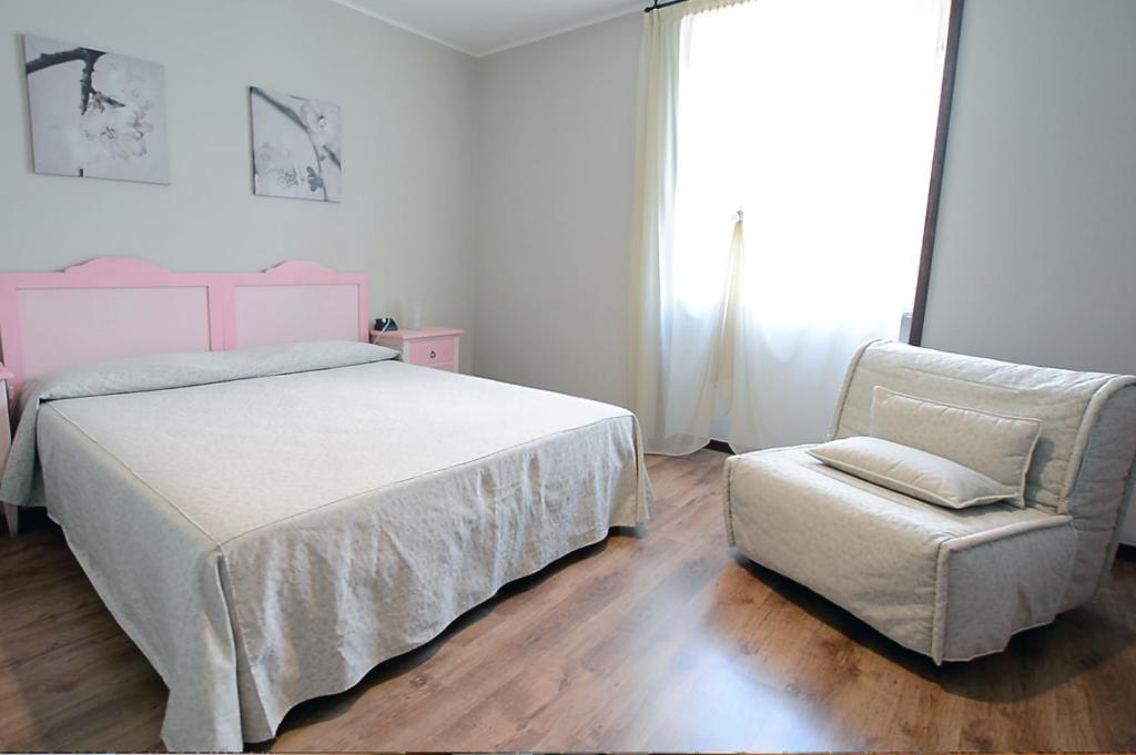 Postel nebo postele na pokoji v ubytování Hotel Risi