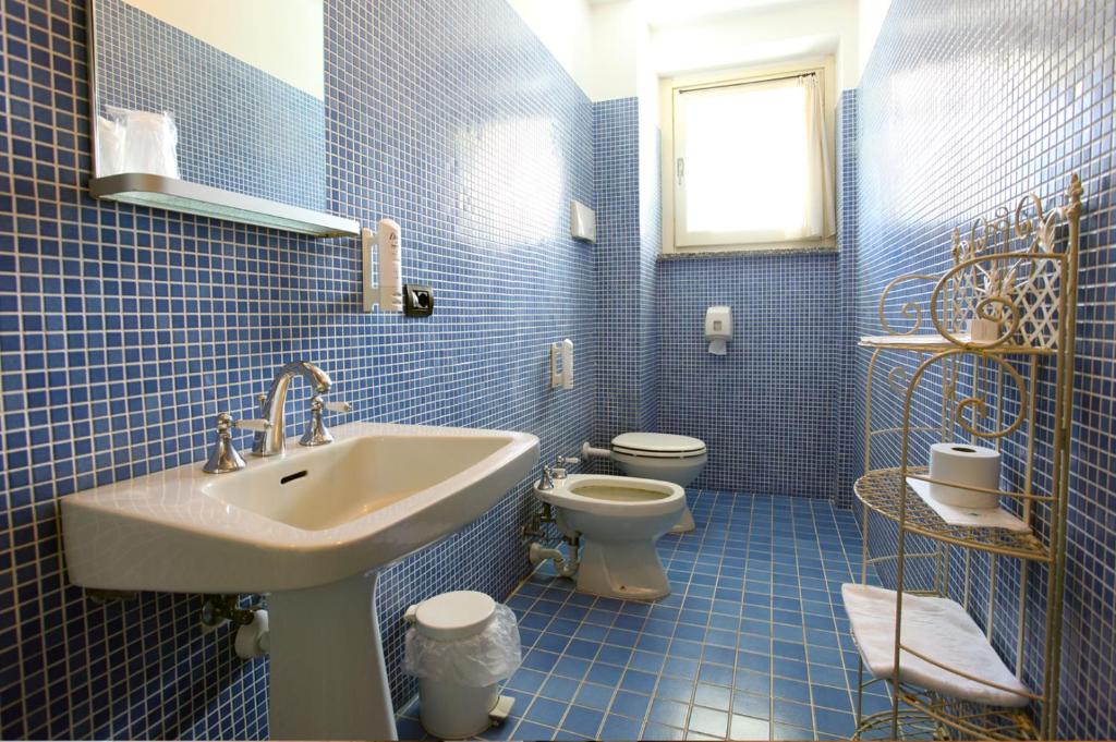 Koupelna v ubytování Hotel Risi