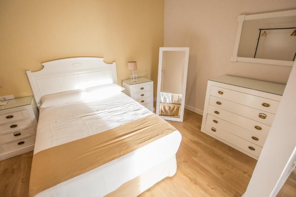 Postel nebo postele na pokoji v ubytování Apartamento Plaza Mayor Cáceres
