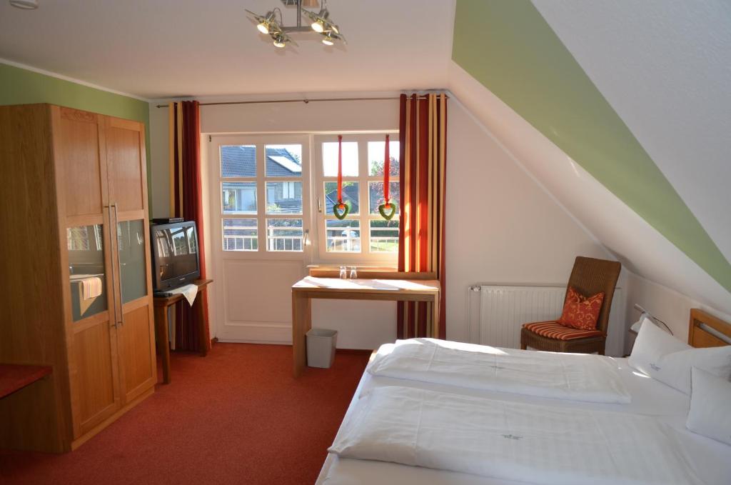 Llit o llits en una habitació de Hotel Gasthof Kruse