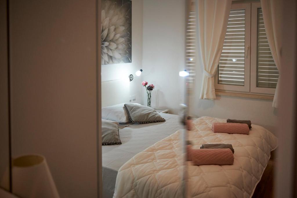 Postel nebo postele na pokoji v ubytování Apartments Proto