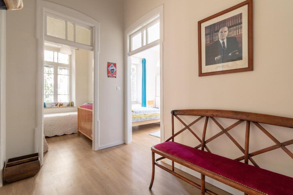a room with a bench and a picture on the wall at The Pearl in Talbyeh in Jerusalem