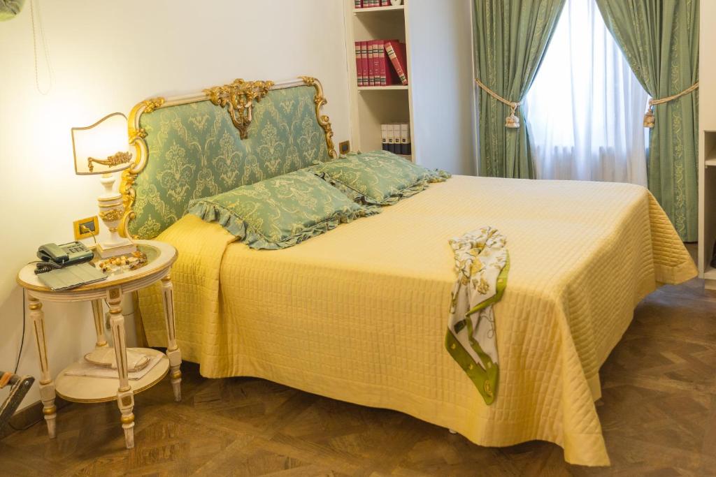 Postel nebo postele na pokoji v ubytování Hotel Palazzo Alexander