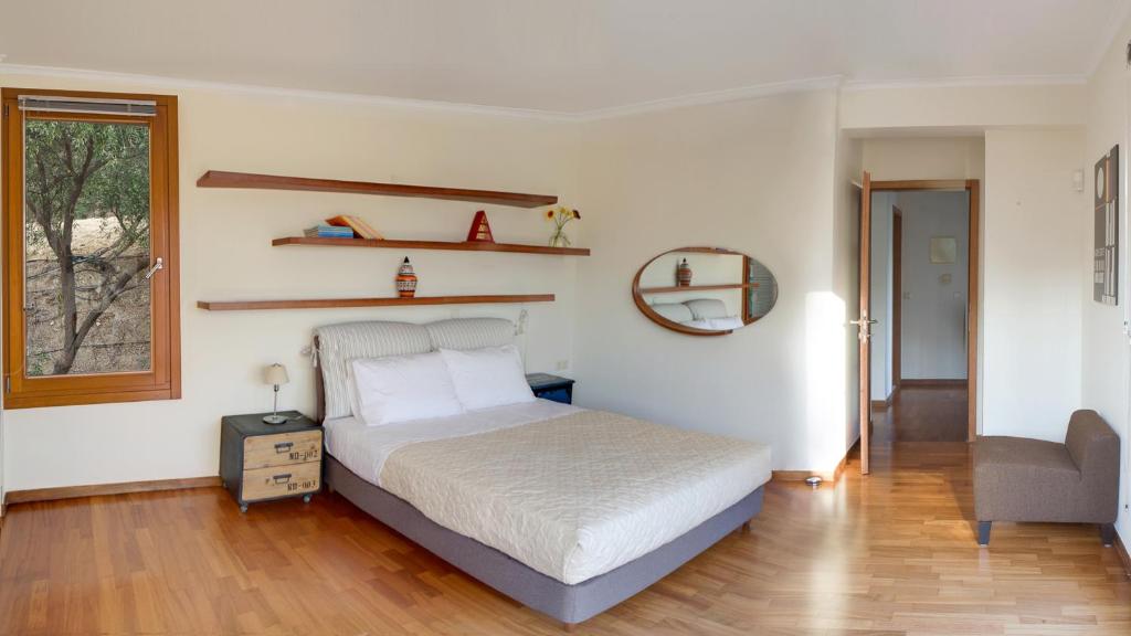 Postel nebo postele na pokoji v ubytování Villa Orgoni