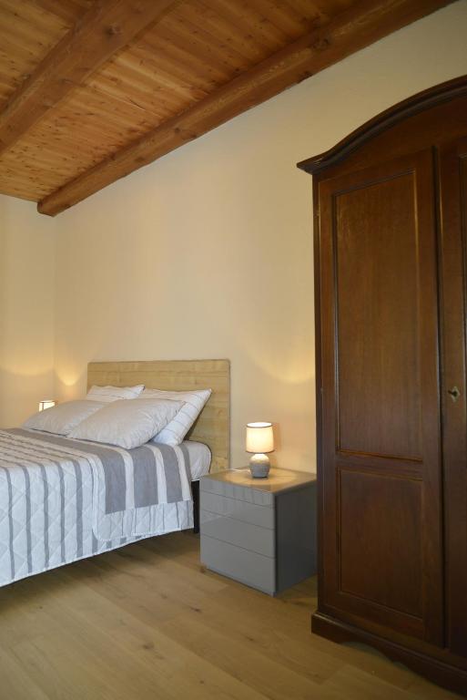 Postel nebo postele na pokoji v ubytování Agriturismo Ai Prüsot