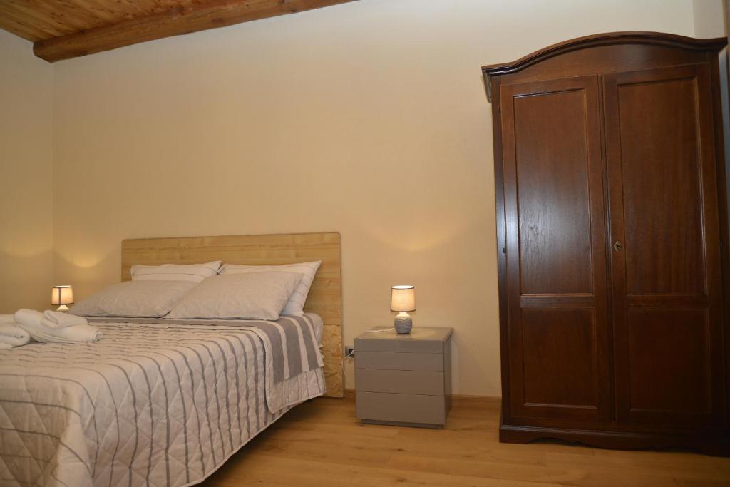 Postel nebo postele na pokoji v ubytování Agriturismo Ai Prüsot