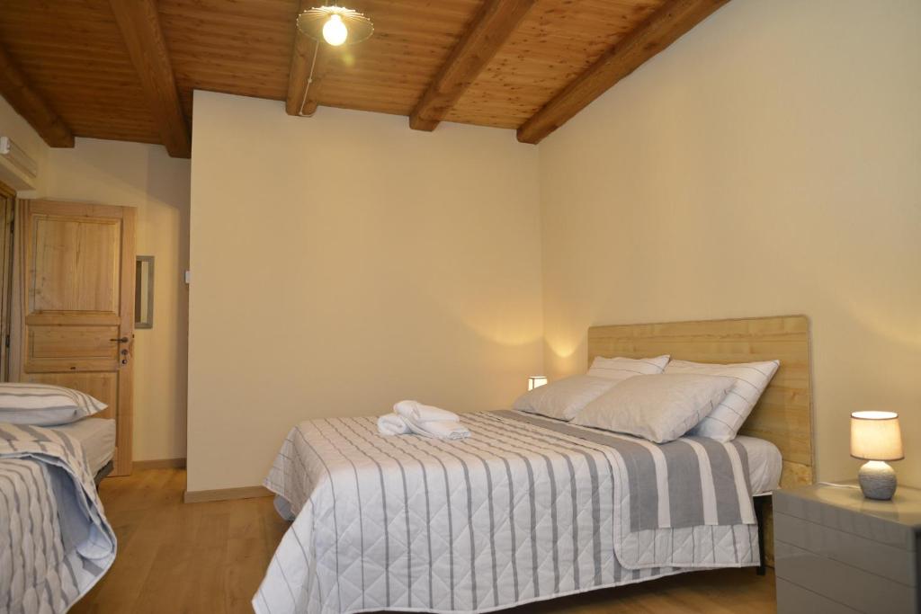 Postel nebo postele na pokoji v ubytování Agriturismo Ai Prüsot