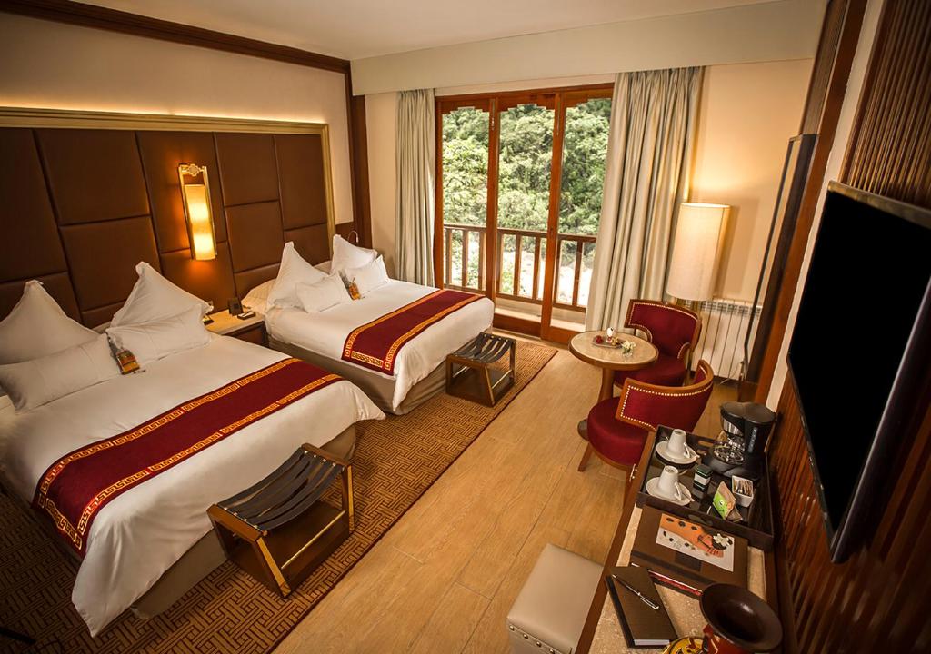 Postel nebo postele na pokoji v ubytování Sumaq Machu Picchu Hotel