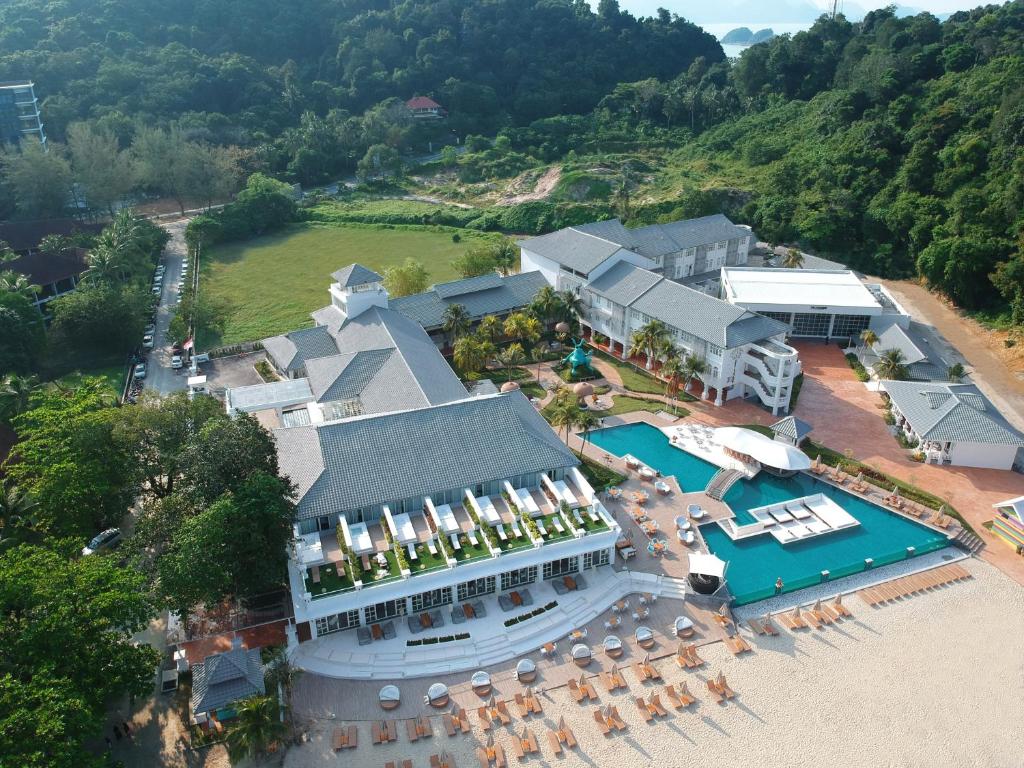 an aerial view of a resort with a pool at Dash Resort Langkawi in Pantai Cenang