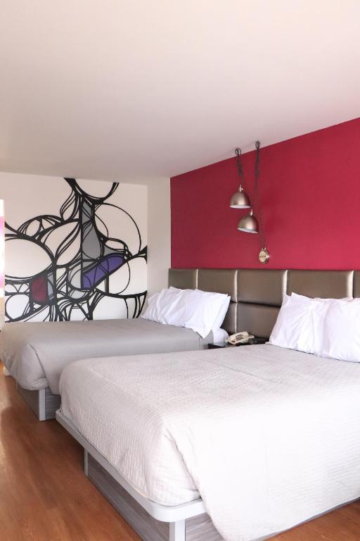 Postel nebo postele na pokoji v ubytování University Inn