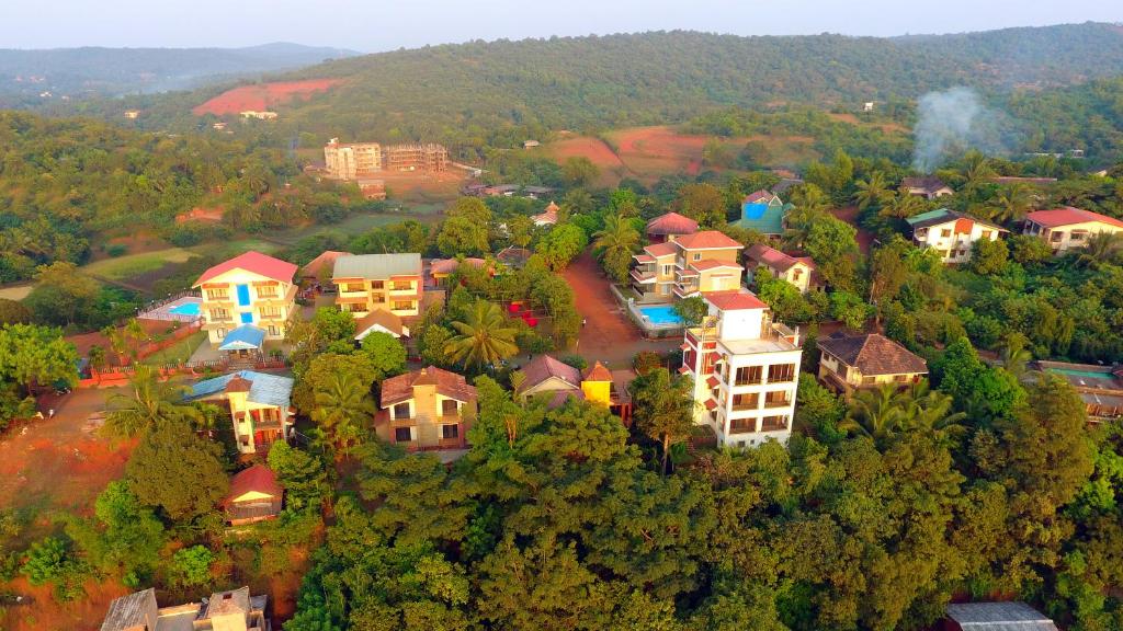 an aerial view of a town with houses and trees at The Mango Inn in Dapoli