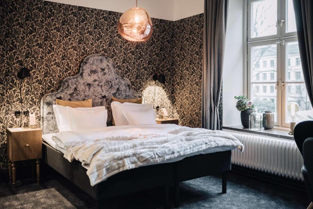Postel nebo postele na pokoji v ubytování NOFO Hotel, WorldHotels Crafted