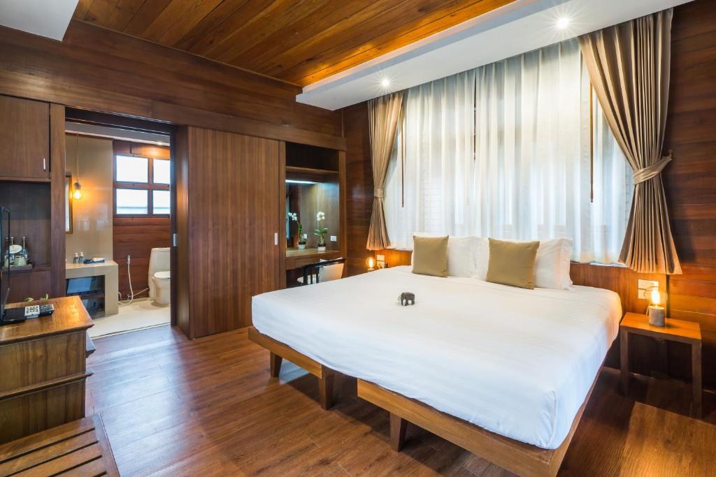 Postel nebo postele na pokoji v ubytování Samui Paradise Chaweng Beach Resort