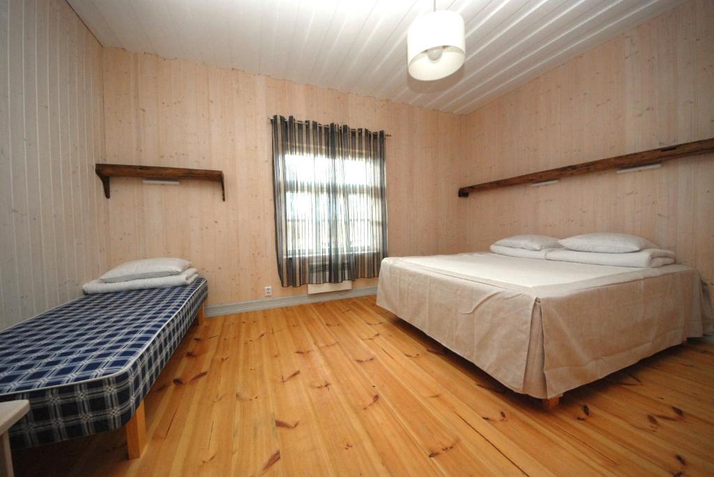 Postel nebo postele na pokoji v ubytování Mandjala Puhketalu - Cottages