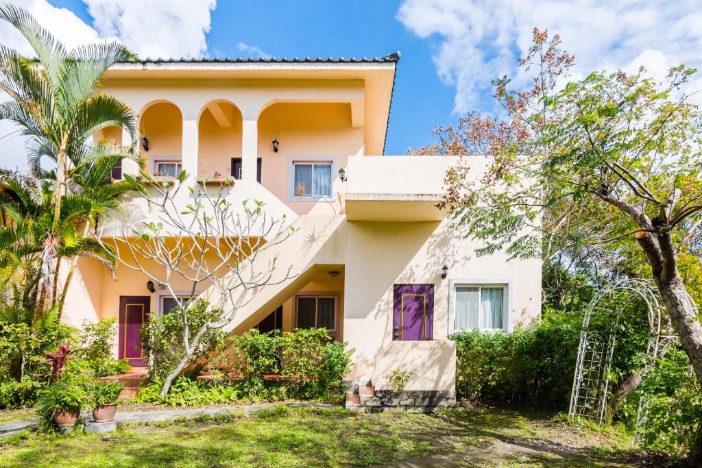 a house with trees in front of it at Dream Home B&B in Hualien City