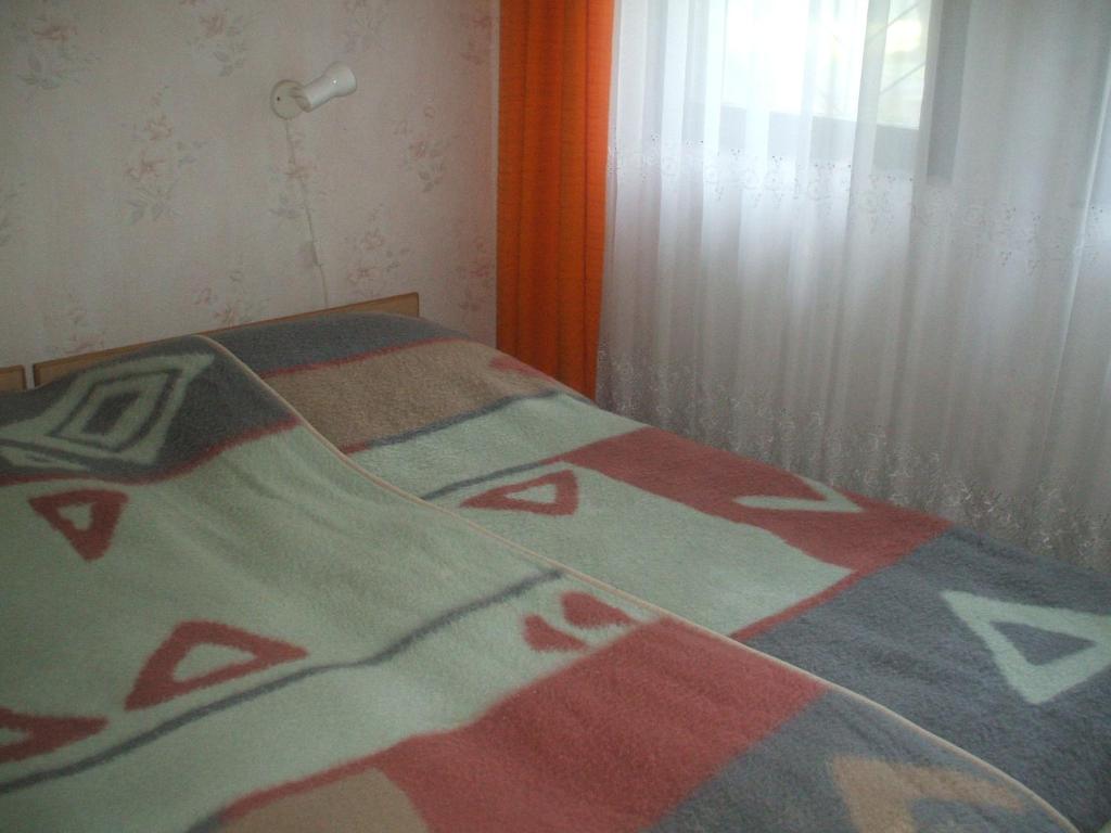 Postel nebo postele na pokoji v ubytování Garabuczi Apartman