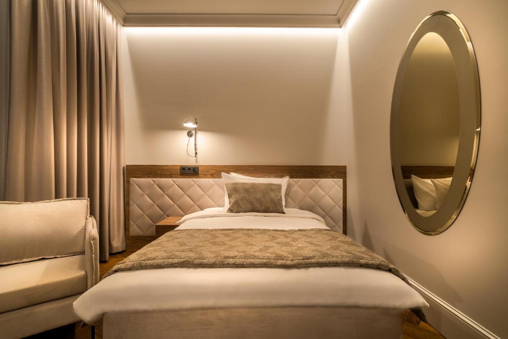 Postel nebo postele na pokoji v ubytování Hotel Vilnia