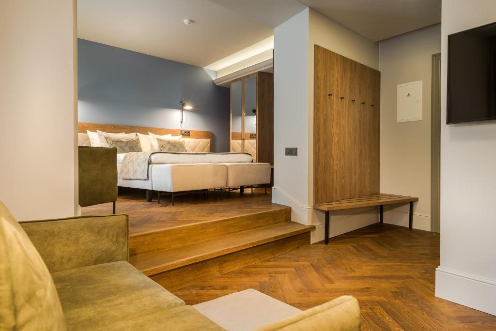 Postel nebo postele na pokoji v ubytování Hotel Vilnia