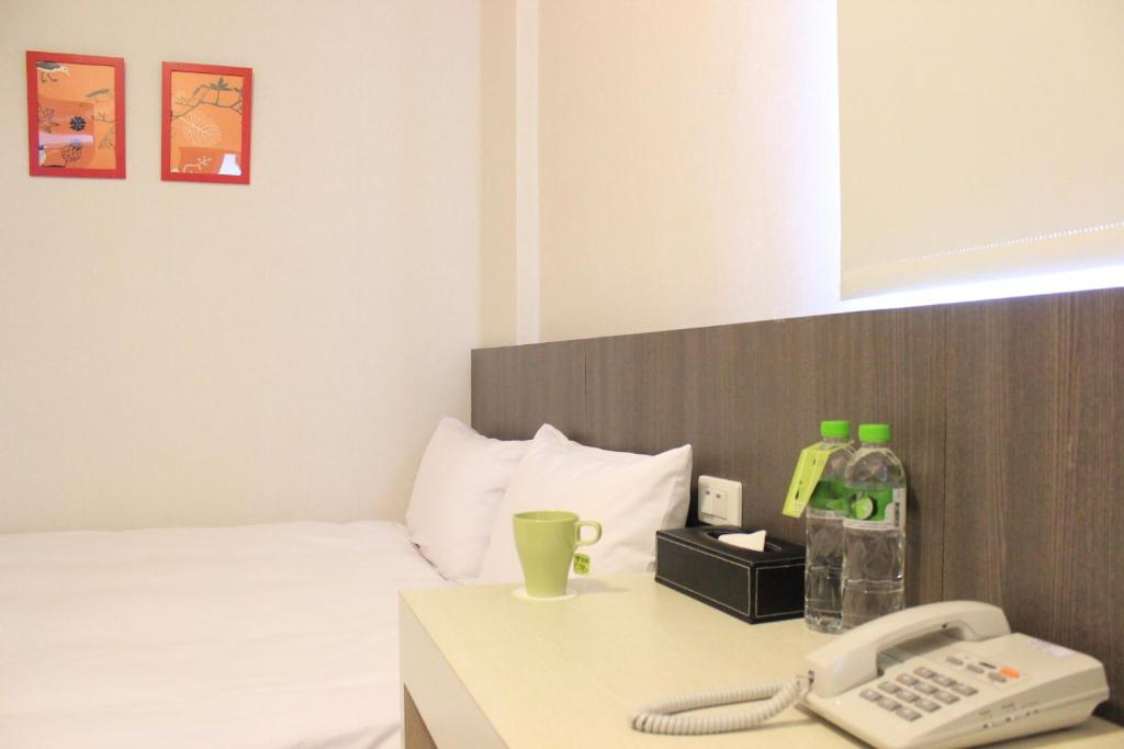 Postel nebo postele na pokoji v ubytování Sunnyside Hotel