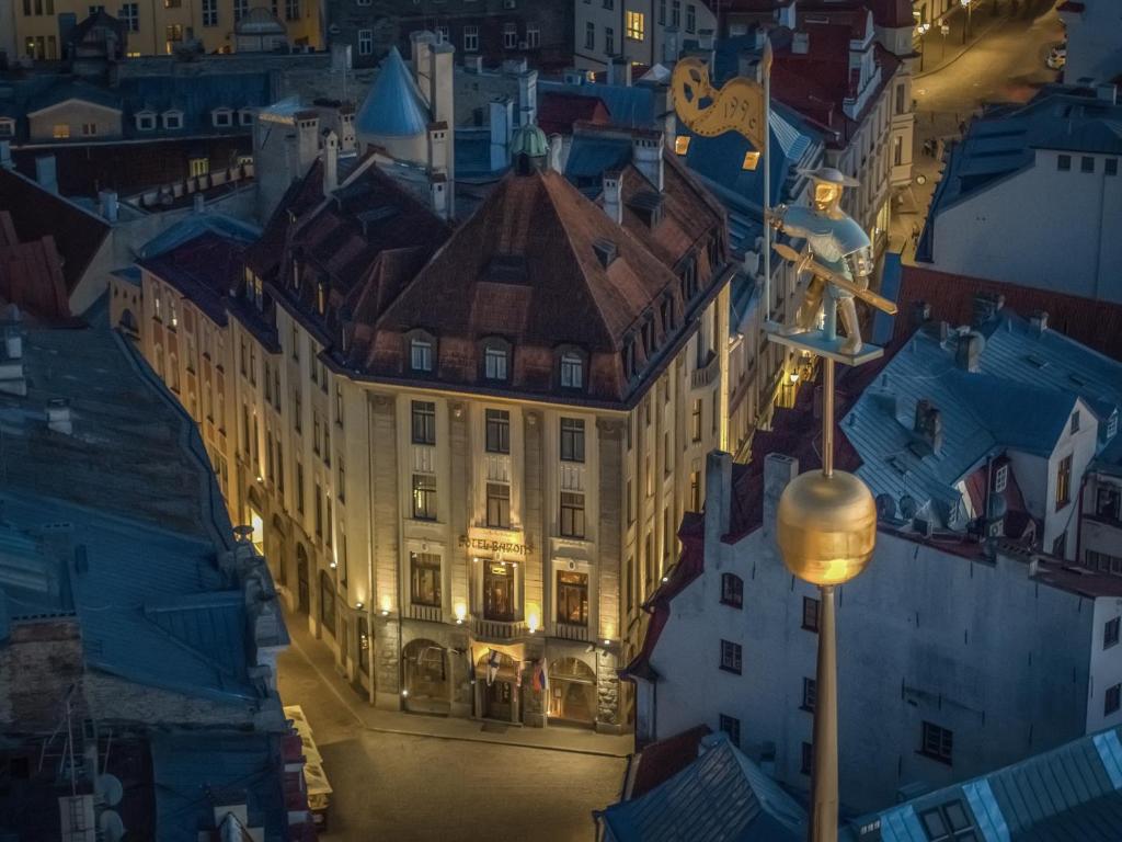 a view of a building in a city at night at Hestia Hotel Barons Old Town in Tallinn