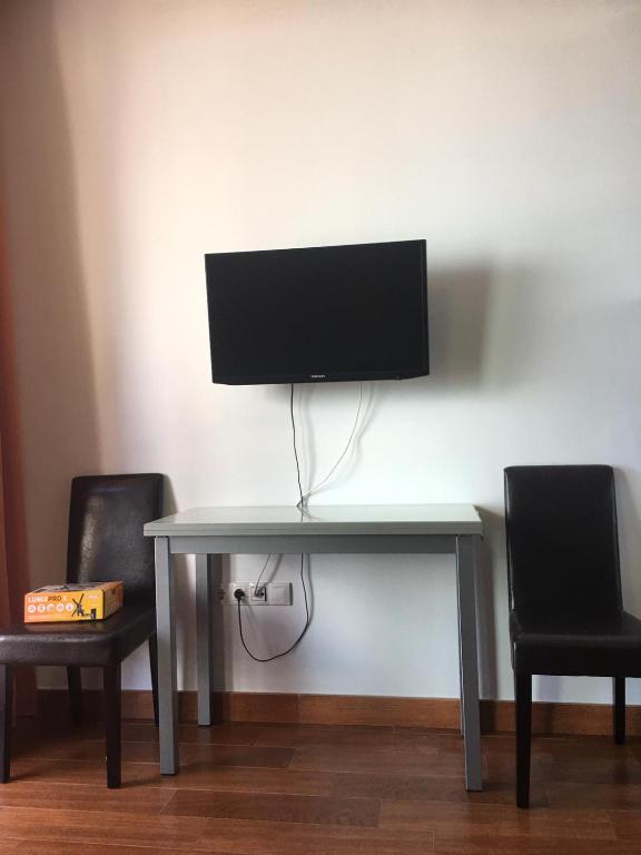 TV a/nebo společenská místnost v ubytování suite canteras