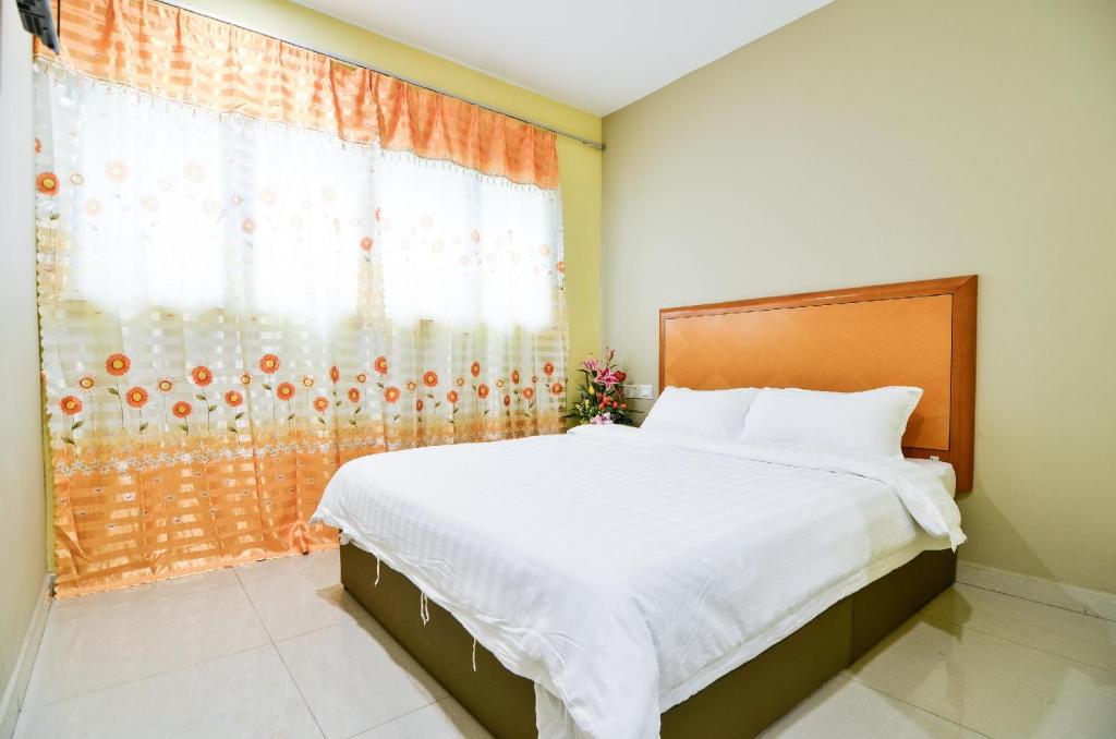 Postel nebo postele na pokoji v ubytování Hotel Raja Bot