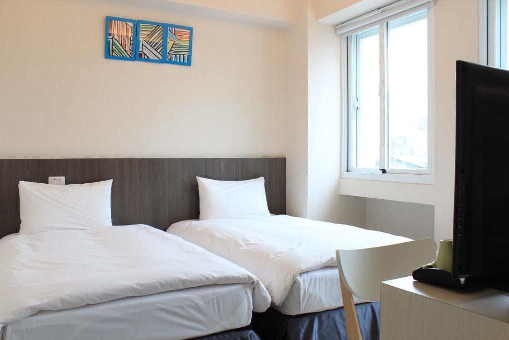 Postel nebo postele na pokoji v ubytování Sunnyside Hotel