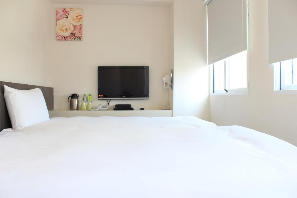Postel nebo postele na pokoji v ubytování Sunnyside Hotel