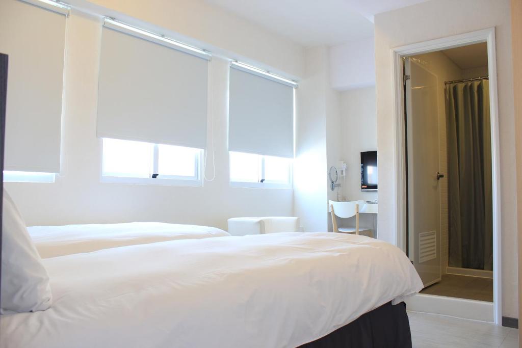 Postel nebo postele na pokoji v ubytování Sunnyside Hotel