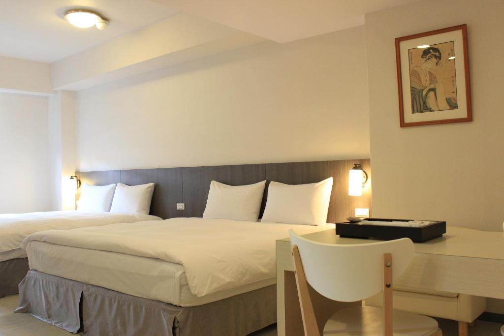 Postel nebo postele na pokoji v ubytování Sunnyside Hotel