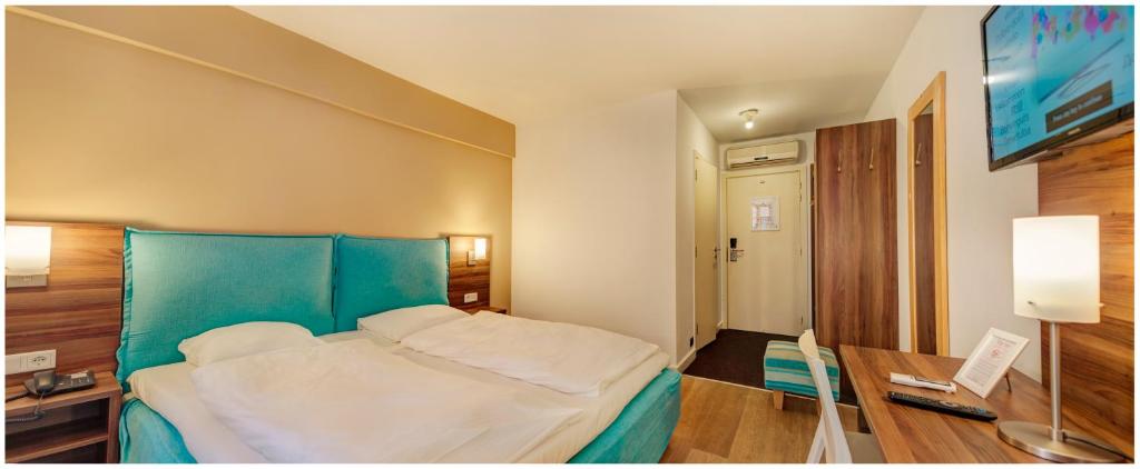 Postel nebo postele na pokoji v ubytování Trip Inn Eden Antwerpen